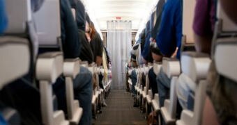 An aisle on a passenger jet.