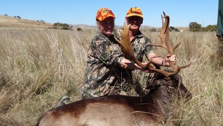 Natasha Holland and Mark Winwood with a deer