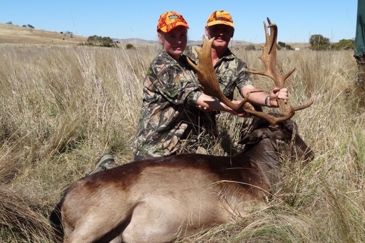 Natasha Holland and Mark Winwood with a deer