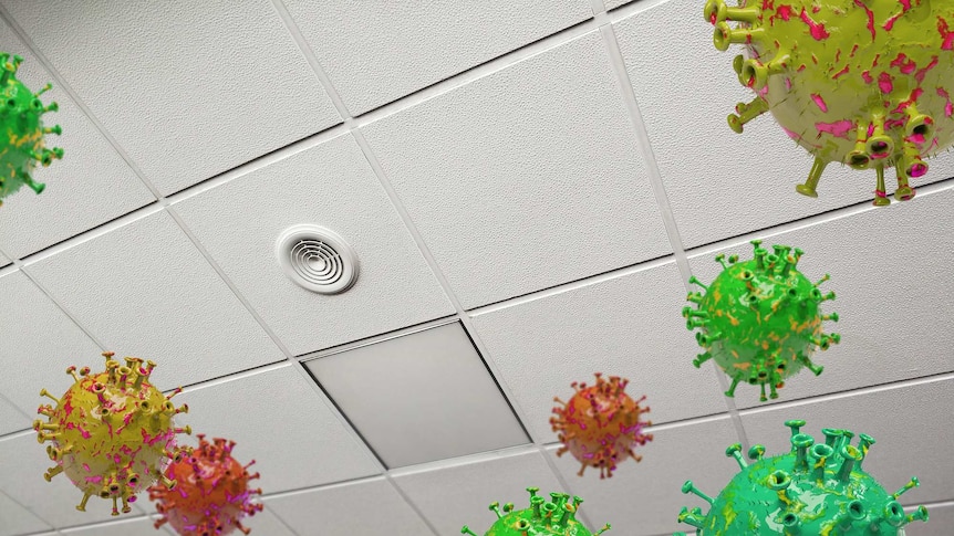 Image of covid viruses suspended in air in a workplace