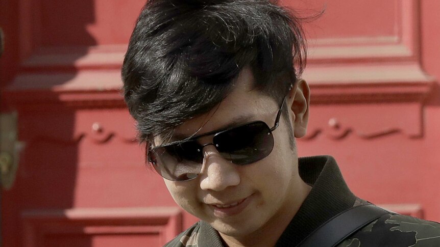Vorayuth "Boss" Yoovidhya leaves a house in London.