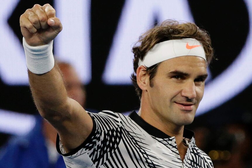 Roger Federer waves to the crowd after his Australian Open win over Tomas Berdych
