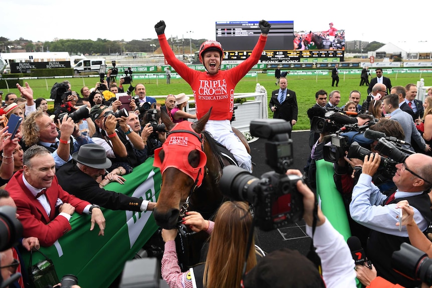 Kerrin McEvoy raises his arms after winning The Everest at Royal Randwick.