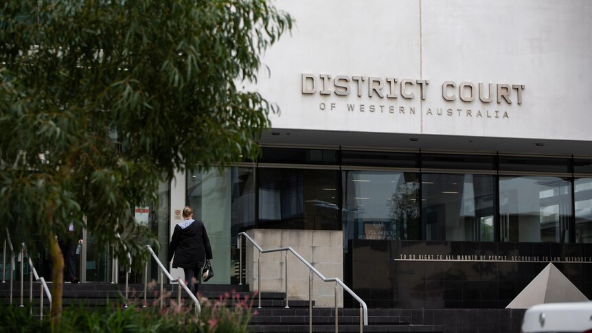 The entrance to the District Court of Western Australia, with a tree to the right of frame.