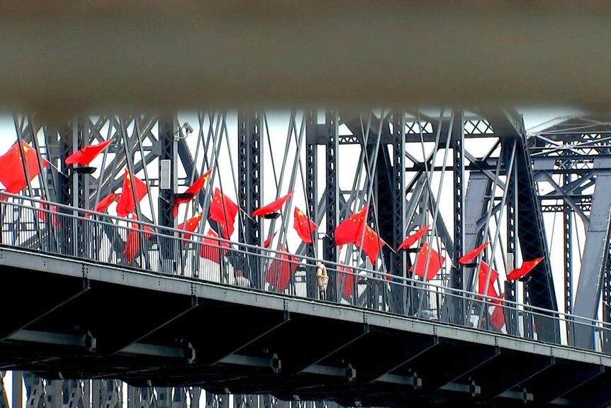 Chinese flags on bridge