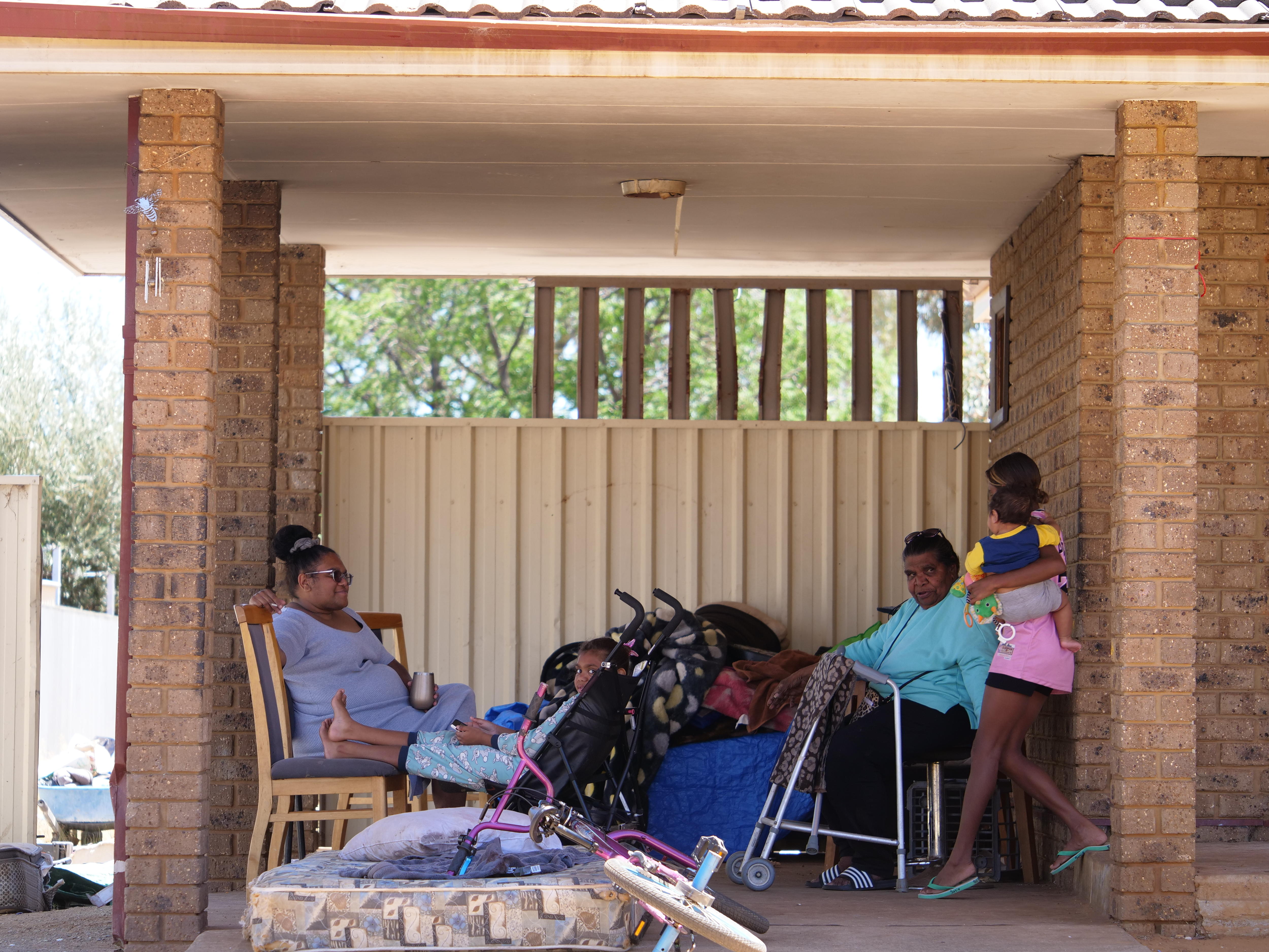 a family in a car port 