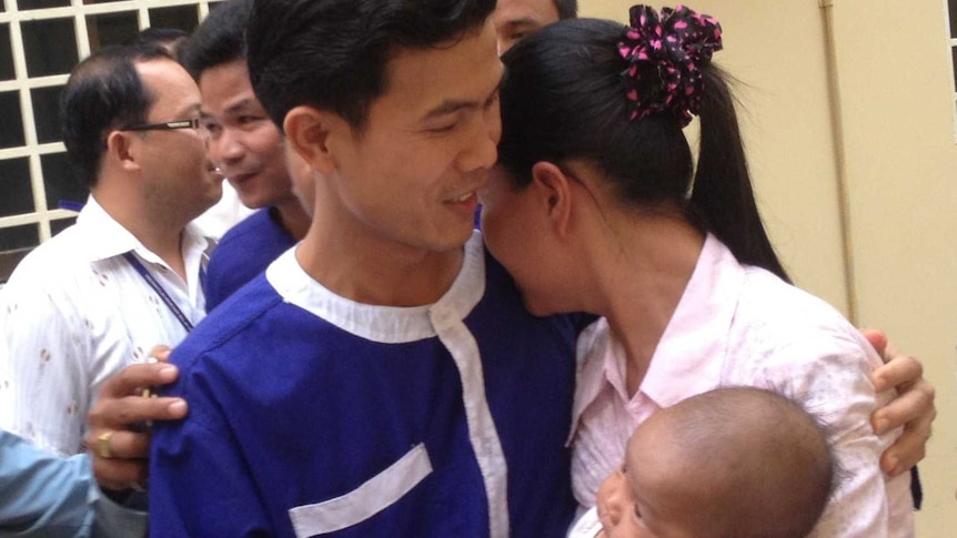 Born Samnang and his sister-in-law embrace just before the trial