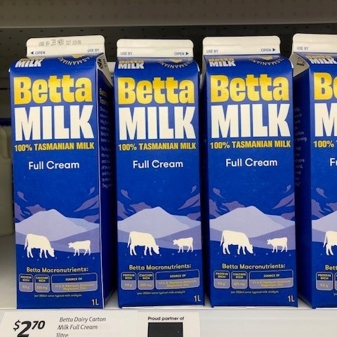 Three milk cartons of Betta Milk side by side in a supermarket in Tasmania