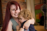 Jo Wright embraces her 2-year-old son Philip at their home in Western Sydney.