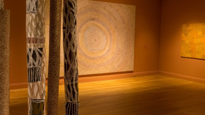 Australian Indigenous artworks hang in a gallery