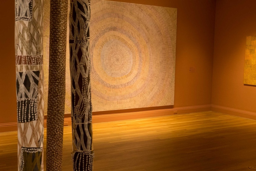 Australian Indigenous artworks hang in a gallery