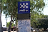 a large police sign on a metal structure