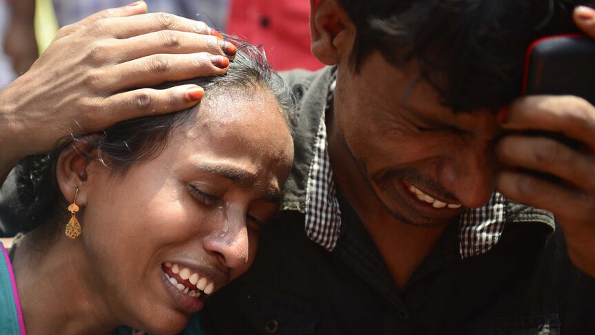 Bangladeshi relatives mourn the victims of a ferry capsize