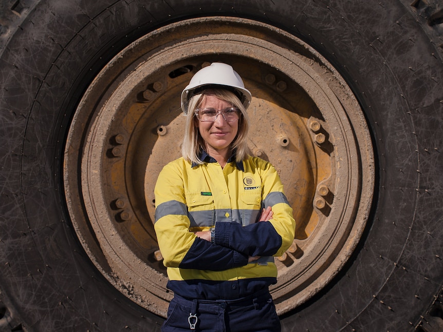 Kelly Carter stands in front of a giant tyre