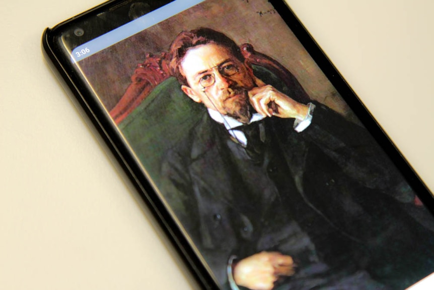 Painting of Russian playwright Anton Chekhov on a phone screen.