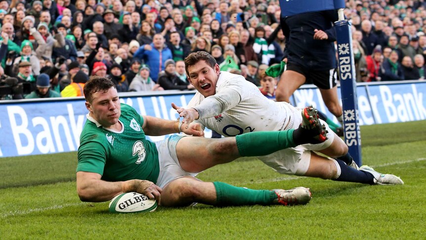Robbie Henshaw of Ireland touches down the ball to score the opening try