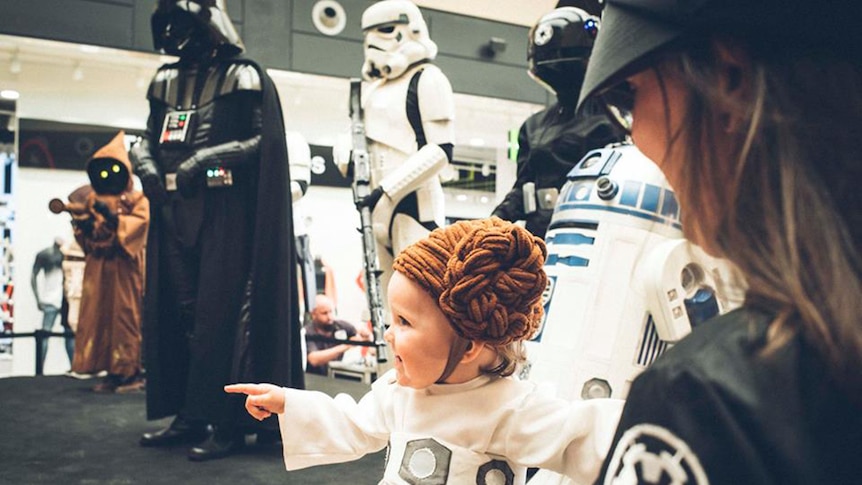 A little girl dressed as Princess Leia from Star Wars
