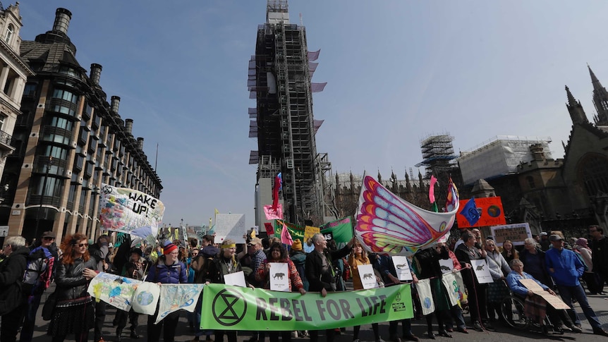 Demonstrators block the road during a climate protest in Parliament Square in London.