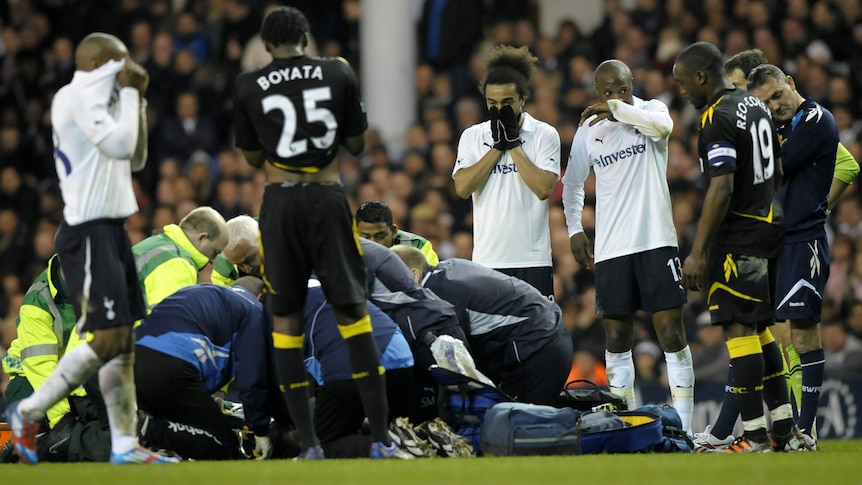 Distressed players look on as Fabrice Muamba is treated by medical staff