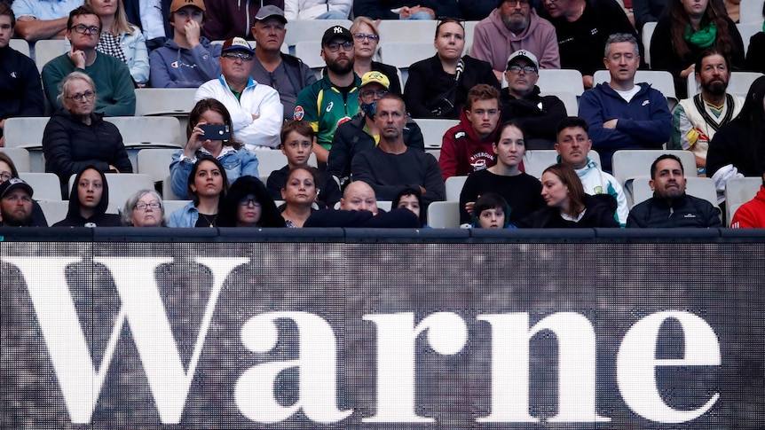 Spectators watch on during Shane Warne's memorial service 