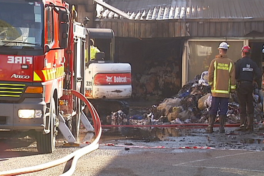 Fire crews attend a blaze at a rag business on Torrens Road in Adelaide.