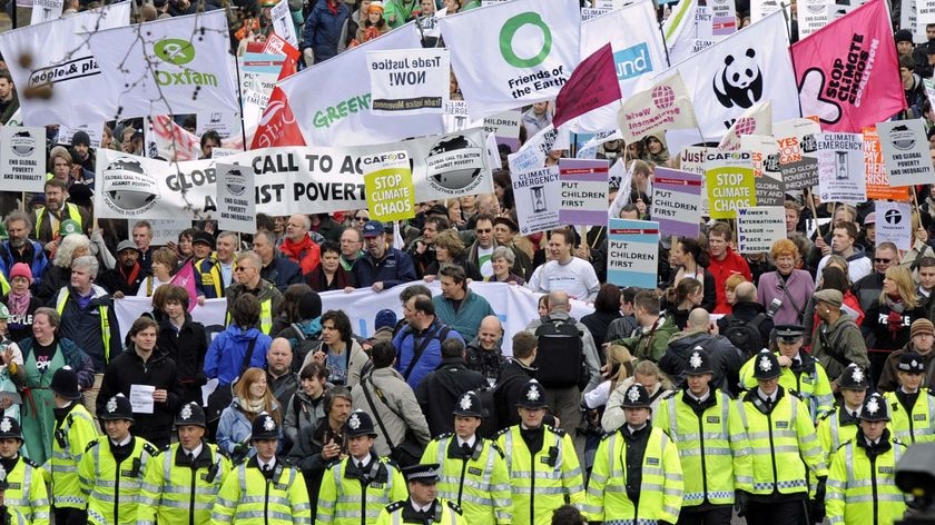 Demonstrators march through central London