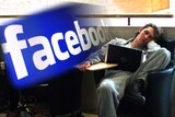 Man slumps in front of his laptop compiled with the Facebook logo