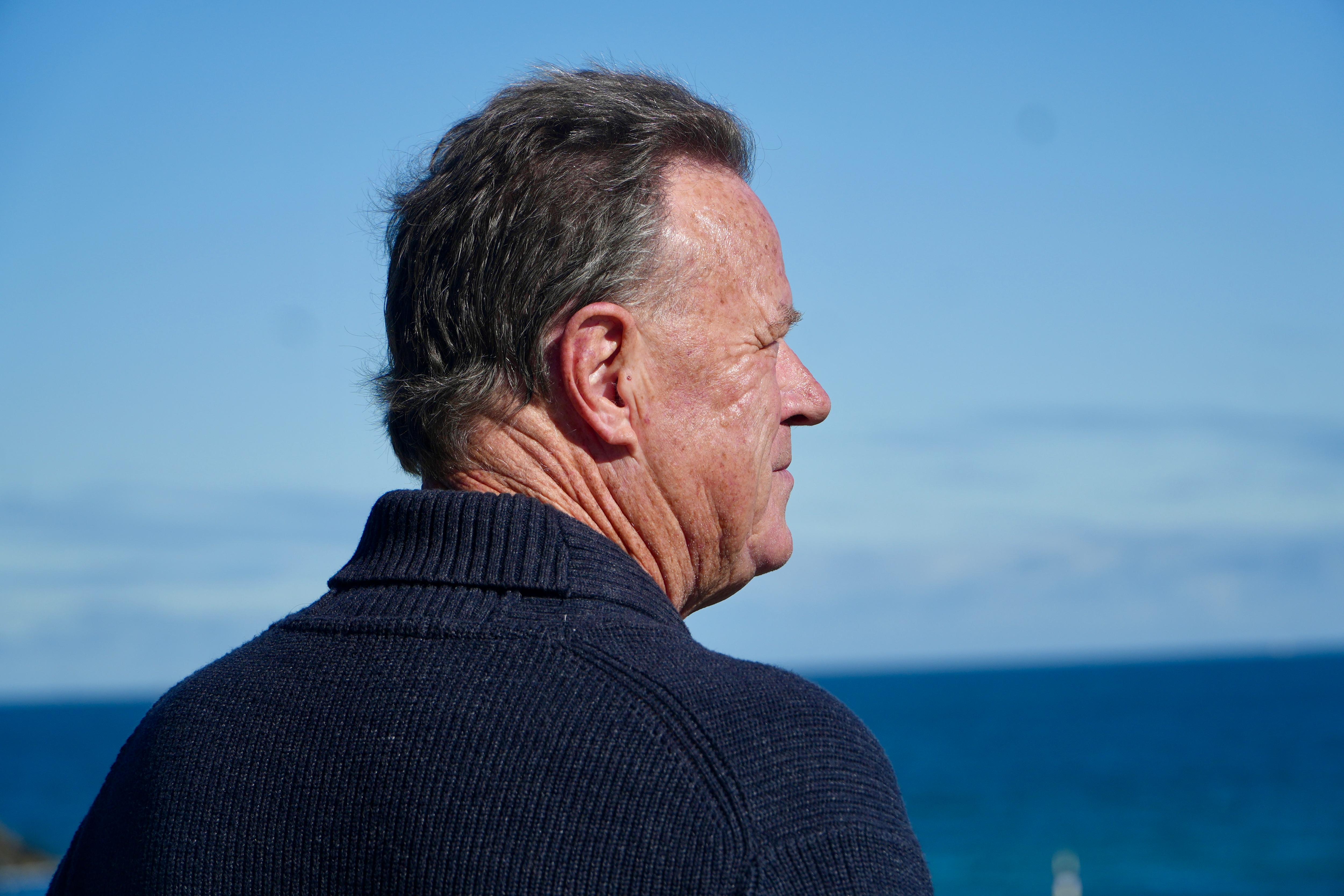 Mark Unsworth looks out to the skyline above the ocean.
