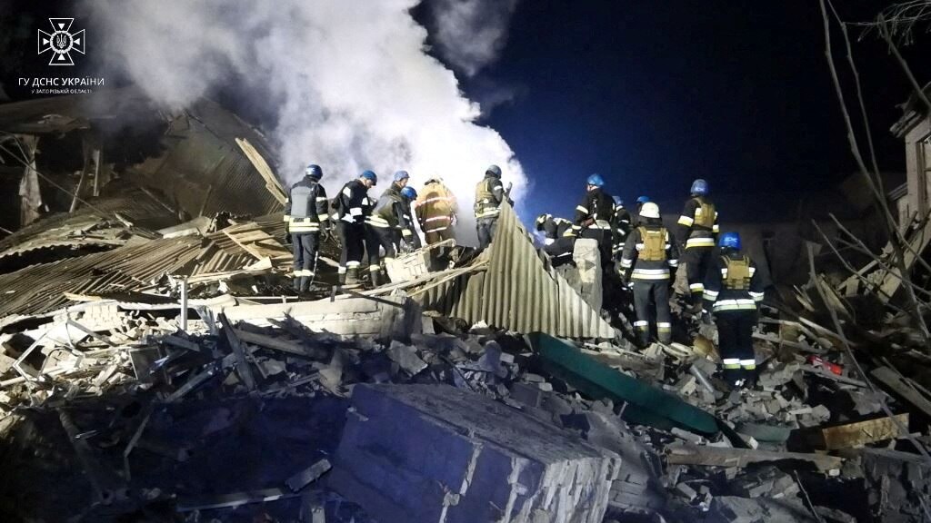 Rescuers work at the site of a maternity ward of a hospital destroyed by a Russian missile attack.