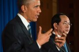 US President Barack Obama speaks as Vietnam's President Tran Dai Quang looks on