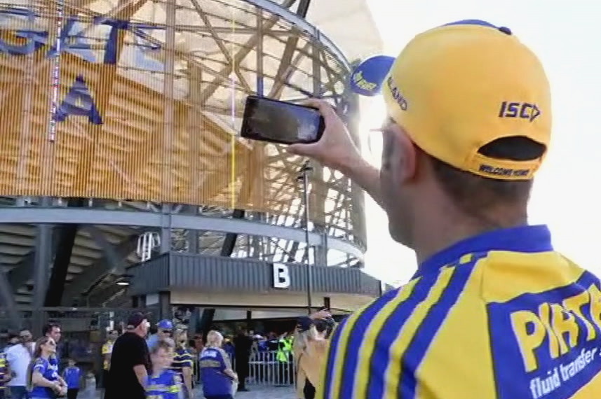 A Parramatta fan taking a photo of the new Western Sydney stadium