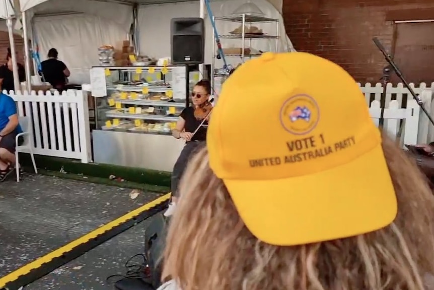 Someone wearing the United Australia Party hat backwards at the Yarraville Festival