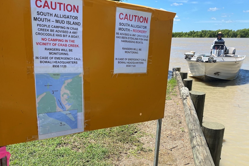 A sign on the banks of the South Alligator River warns that two crocs have recently been spotted.