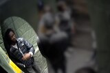 a man in a puffer jacket shown on CCTV footage