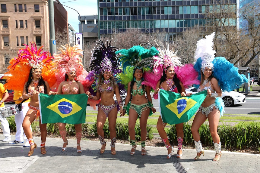 Brazilian dancers with the Brazilian flag