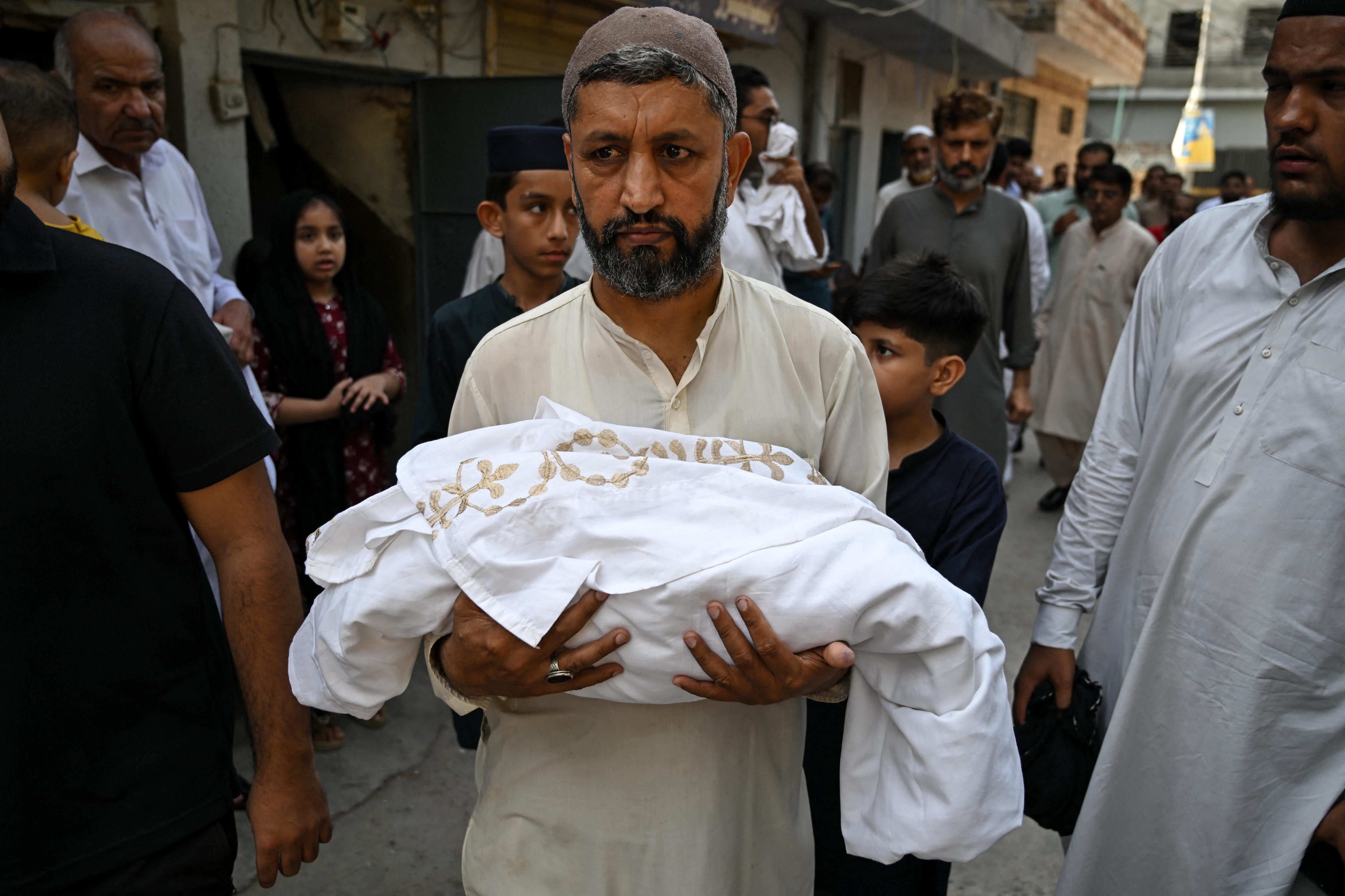 Doors 'closed' at Pakistan hospital where fire killed 14 babies, witness says