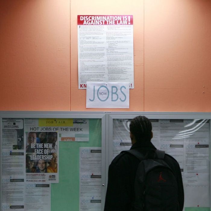 A man looks over employment opportunities at a jobs centre.