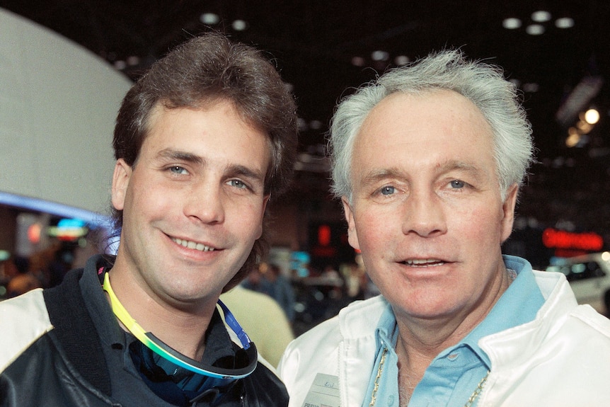 Robbie Knievel and Eval Knievel pose at a conference in 1989