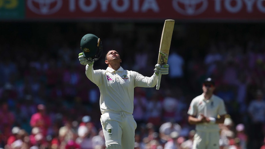 Usman Khawaja looks to the sky after reaching his century on day three of the fifth Ashes Test at the SCG.