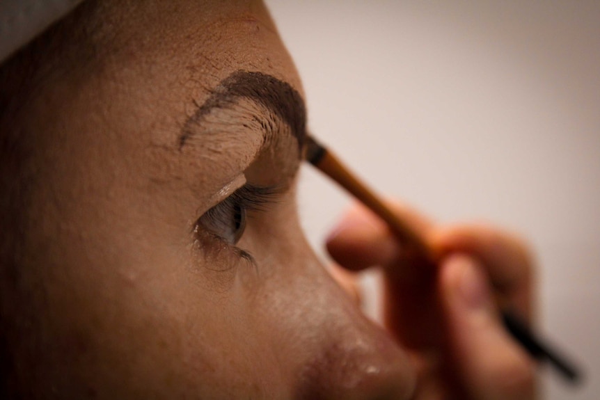 A close up shot of jay Jay Carroll applying brows.