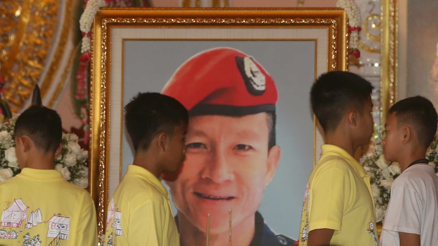 Members of the Thai soccer team pay respects to Saman Gunan