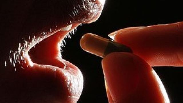 person taking a pill medicine medication generic thumbnail