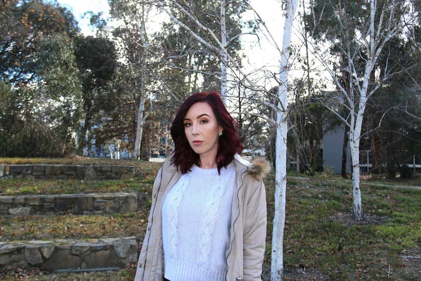 Teyarna Matheson stands with trees in the background.