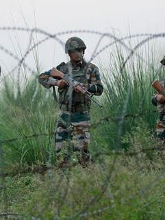 Indian army soldiers patrol near the highly militarized Line of Control dividing Kashmir between India and Pakistan.