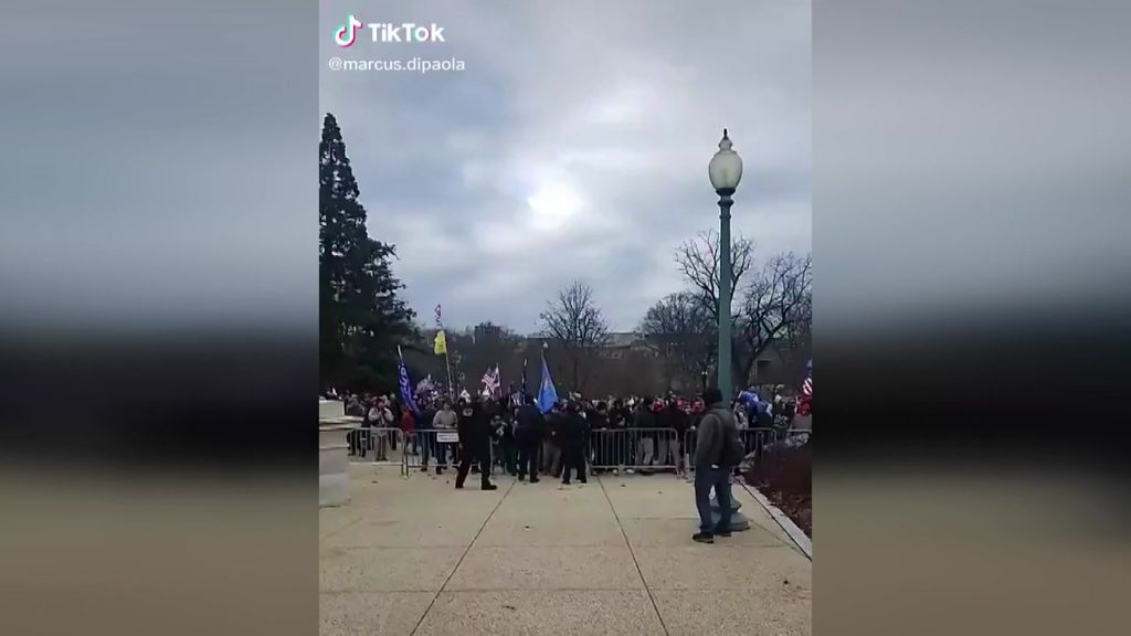 Protesters walk through police lines outside Capitol building. - ABC News