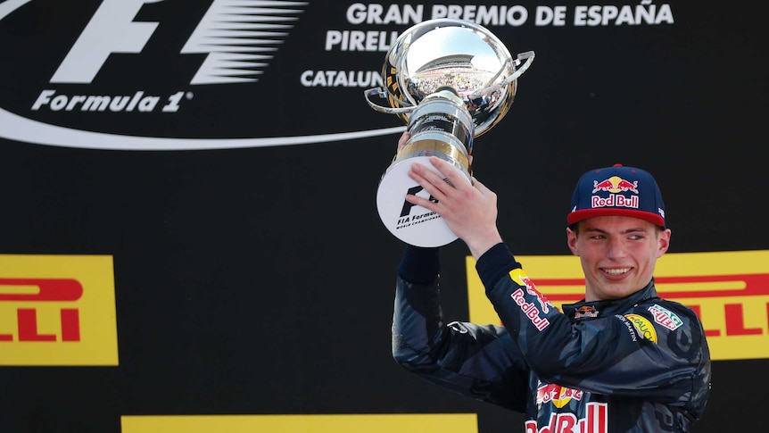 Red Bull driver Max Verstappen holds the trophy after winning the Spanish Formula One Grand Prix.