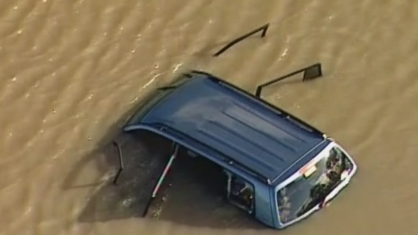 The car lies in a lake near the intersection of Manor Lakes Boulevard and Pedder Street.