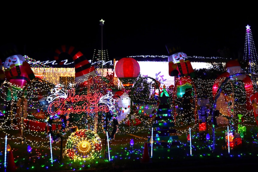 A lawn completely covered in lights of many different shapes and sizes.