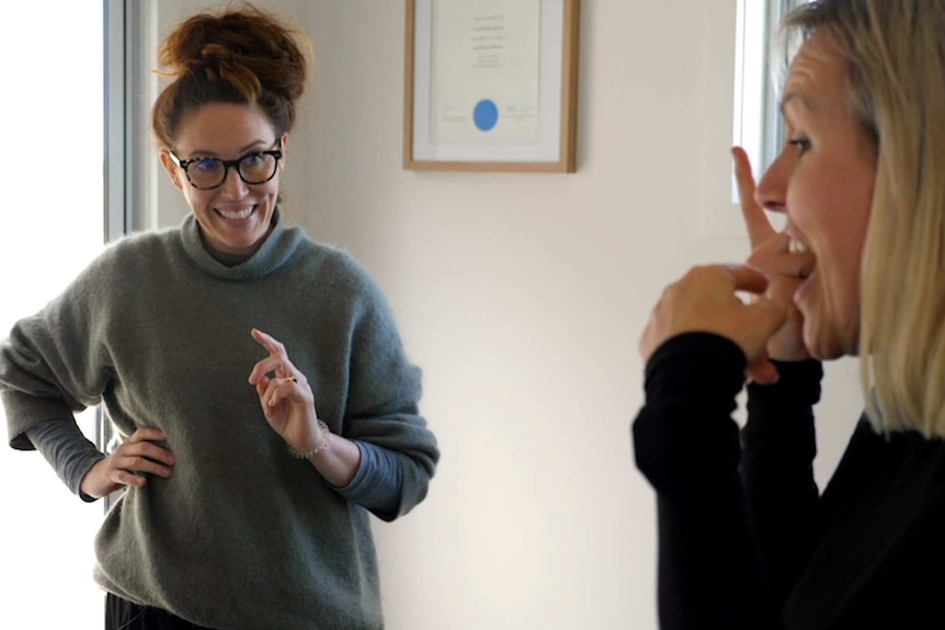 Two women in singing lesson