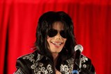 Michael Jackson speaks at a press conference